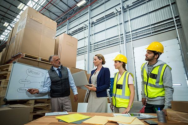 team portrait of workers in warehouse